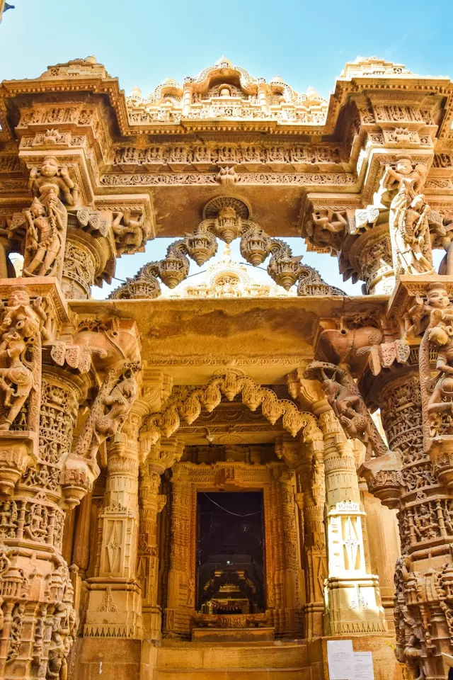a very ornate building with a bunch of carvings on it - Exploring the Majestic Palaces and Forts of Rajasthan
