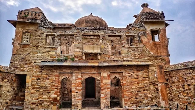 an old stone building with a dome on top - Exploring the Majestic Palaces and Forts of Rajasthan